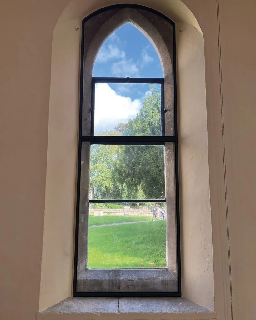 The team installed 12 shaped slimline units and 3 slimline units, all in a bespoke dark grey colour to fit the stone window surrounds. The team installed 12 shaped slimline units and 3 slimline units, all in a bespoke dark grey colour to fit the stone window surrounds.
